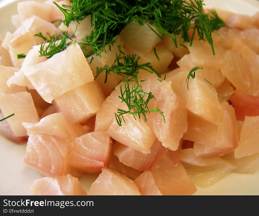 Tilapia cubed and waiting to join the chowder. Fresh dill is keeping it company.