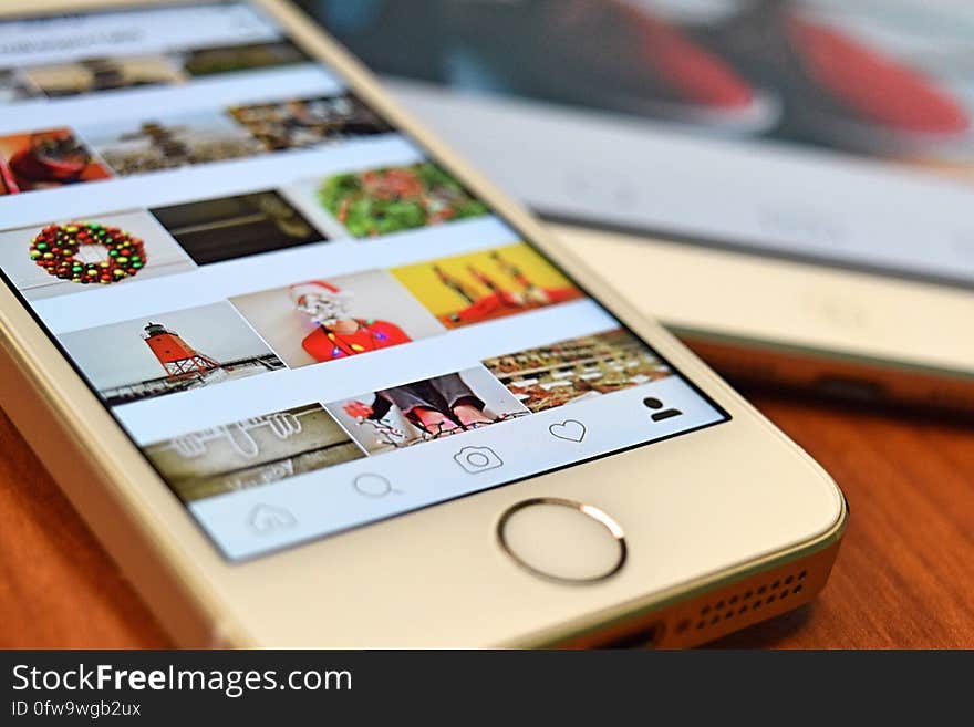 Silver Iphone 5s on Brown Wooden Table