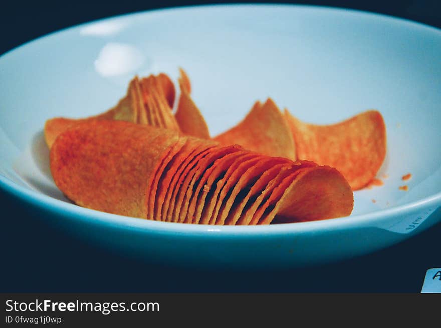 A plate with potato chips. A plate with potato chips.