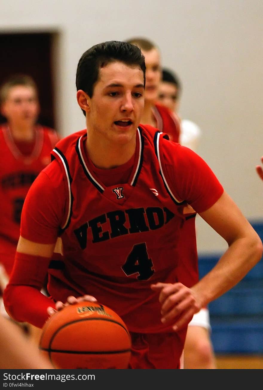 Man With Vernoa 4 Basketball Jersey Holding the Basketball