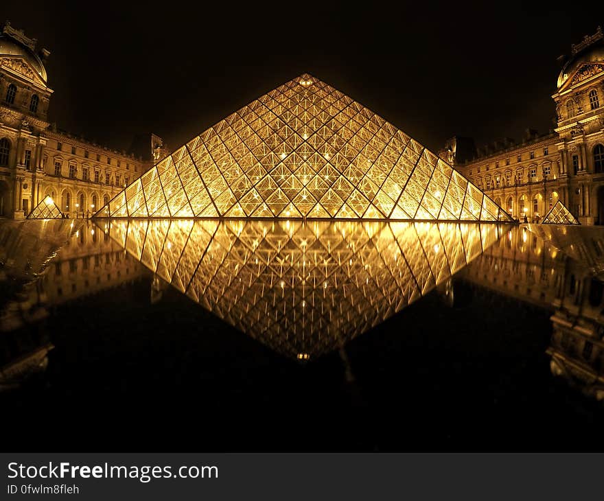 The Louvre pyramid n the main courtyard (Cour Napoléon) of the Louvre Palace (Palais du Louvre) in Paris.