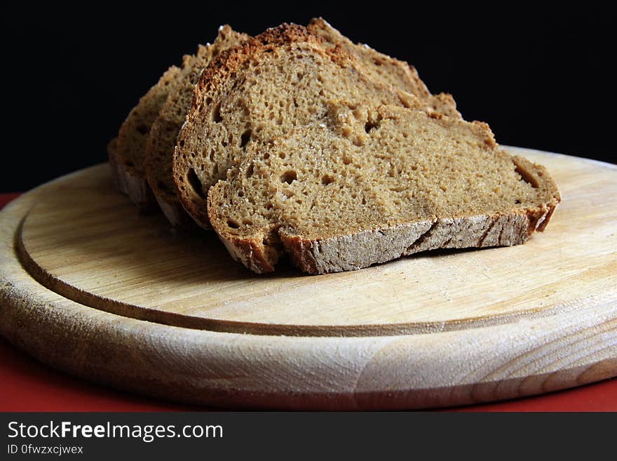 Brown Bread on Round Wooden Tray