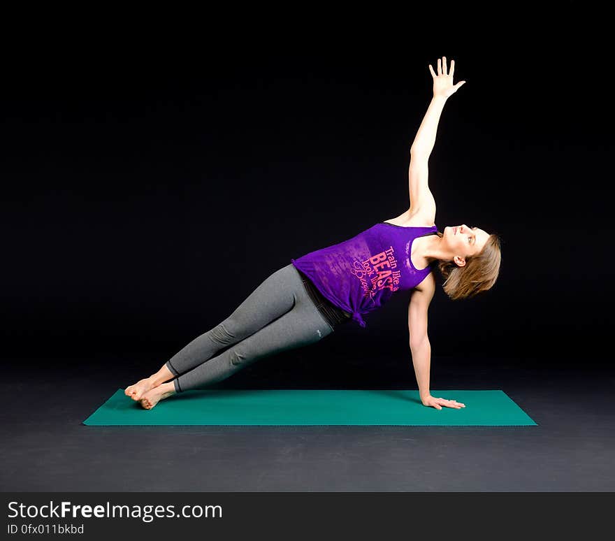 Woman in Purple Tank Top and Gray Sweat Pants