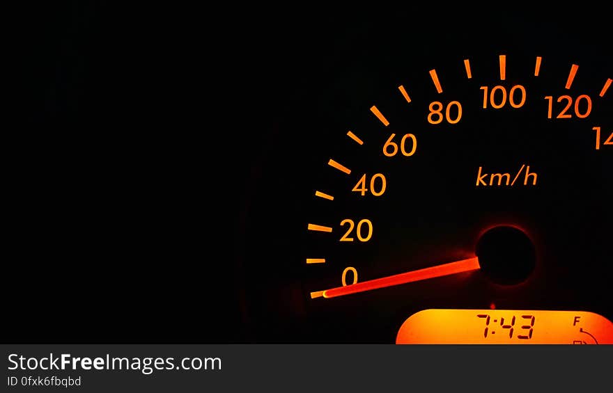 Close up of automotive speedometer gauge measured in kilometers per hour.