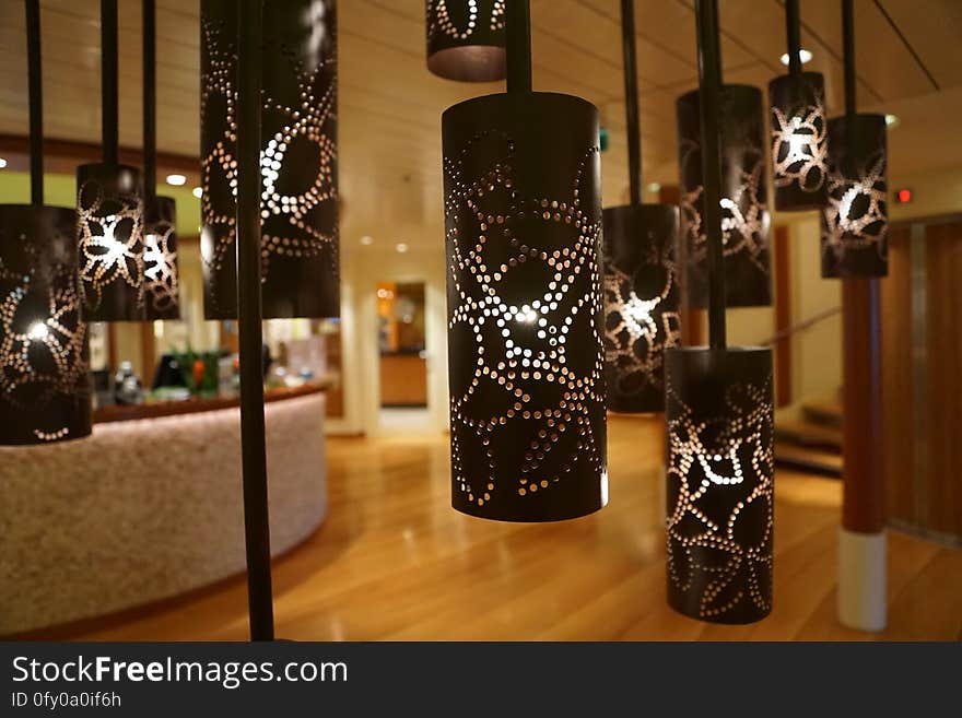 Lamps hanging from ceiling with cylindrical shades. Lamps hanging from ceiling with cylindrical shades.