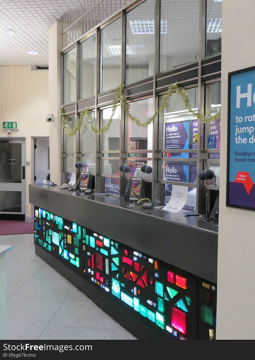 The illuminated counter was a feature of this bank branch for decades, although it had been cut down a bit from its original size when this picture was taken in 2014. With counters out of fashion in banks nowadays, this counter has since been removed. Happily, a small part of the glasswork has been retained as a wall decoration. The illuminated counter was a feature of this bank branch for decades, although it had been cut down a bit from its original size when this picture was taken in 2014. With counters out of fashion in banks nowadays, this counter has since been removed. Happily, a small part of the glasswork has been retained as a wall decoration.