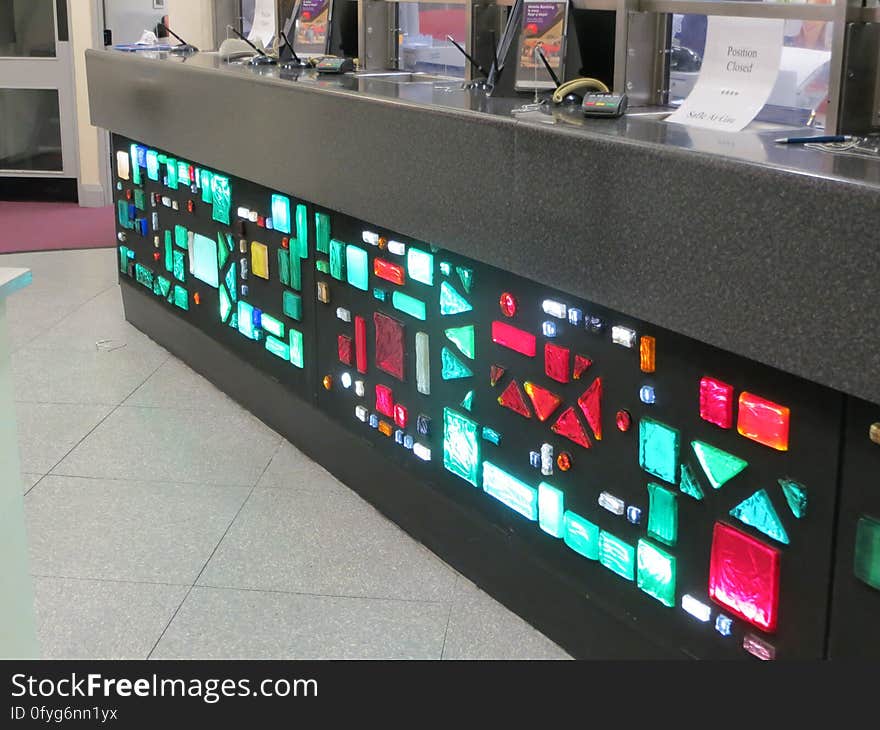 The illuminated counter was a feature of this bank branch for decades, although it had been cut down a bit from its original size when this picture was taken in 2014. With counters out of fashion in banks nowadays, this counter has since been removed. Happily, a small part of the glasswork has been retained as a wall decoration. The illuminated counter was a feature of this bank branch for decades, although it had been cut down a bit from its original size when this picture was taken in 2014. With counters out of fashion in banks nowadays, this counter has since been removed. Happily, a small part of the glasswork has been retained as a wall decoration.