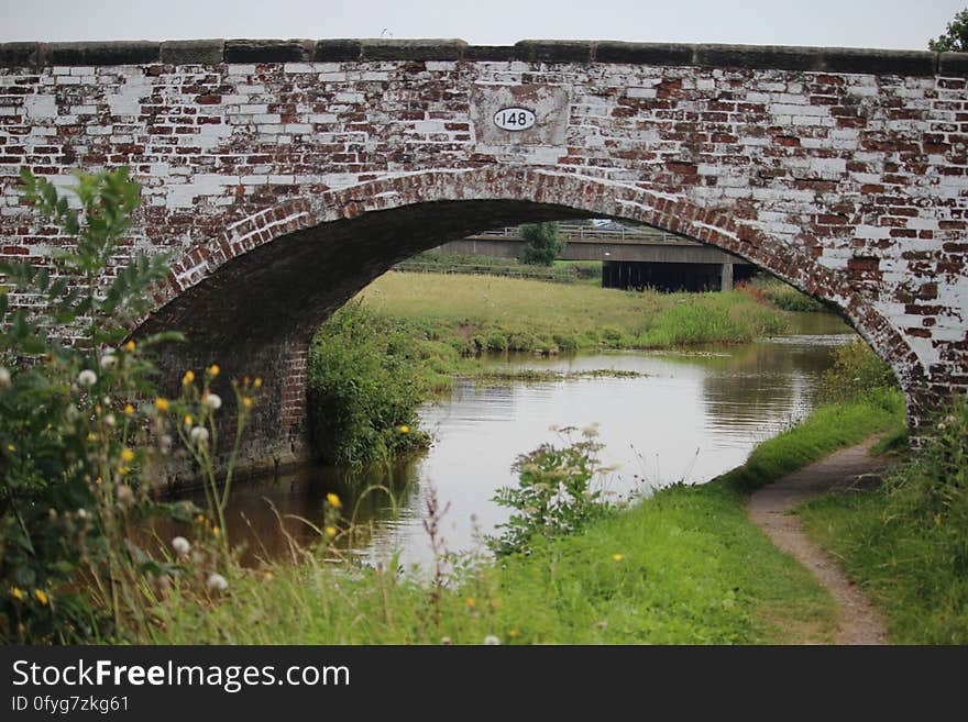 Known locally as the White Bridge. In the background is Bridge 147a carrying the M6 over the Trent & Mersey Canal. Known locally as the White Bridge. In the background is Bridge 147a carrying the M6 over the Trent & Mersey Canal.