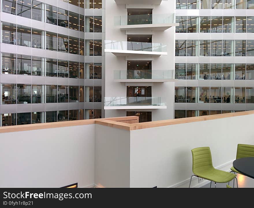 A view from a balcony to the inner court of an office block building.