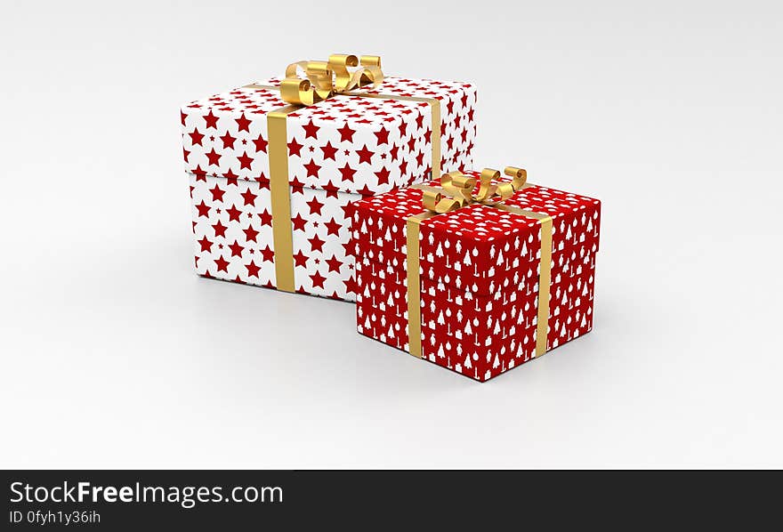 A pair of presents wrapped in paper with ribbons. A pair of presents wrapped in paper with ribbons.