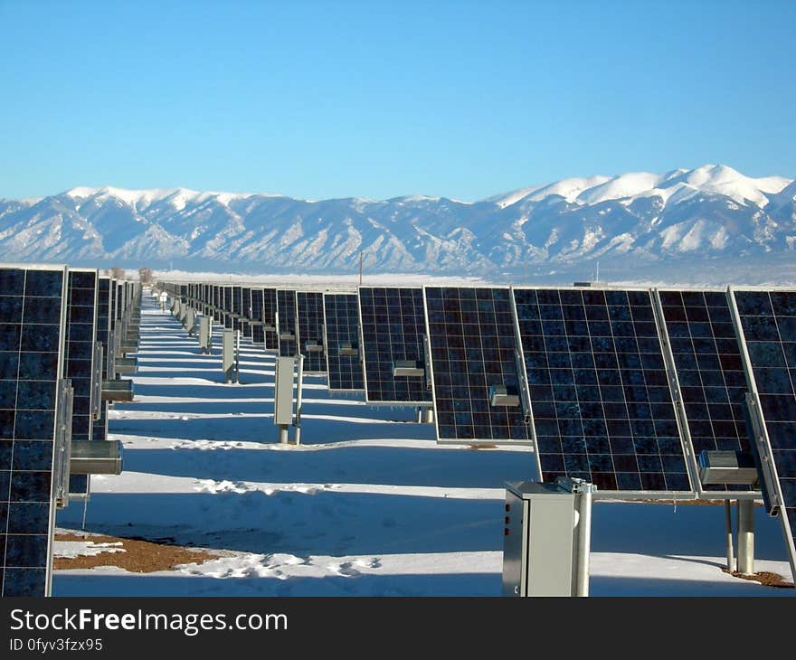 Silver and Black Solar Panels on Snow Covered Ground