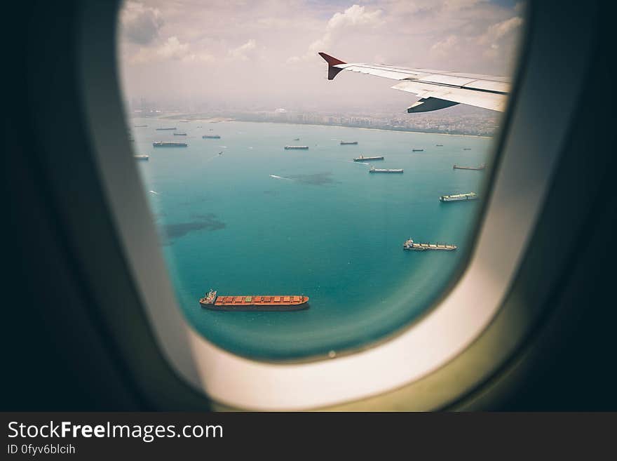 Ships at sea seen from the window of an airplane. Ships at sea seen from the window of an airplane.