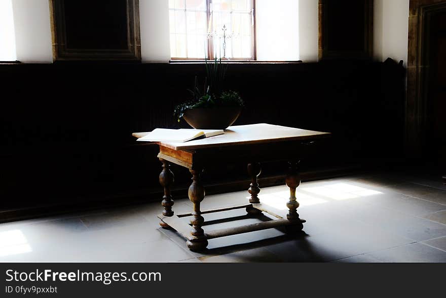 An antique table in a room.