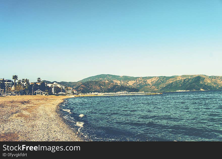 Empty beach shoreline on sunny day. Empty beach shoreline on sunny day.