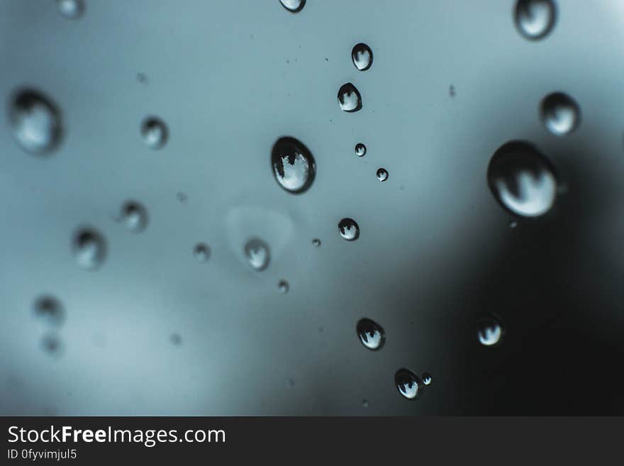 A glass with drops of water on the surface. A glass with drops of water on the surface.