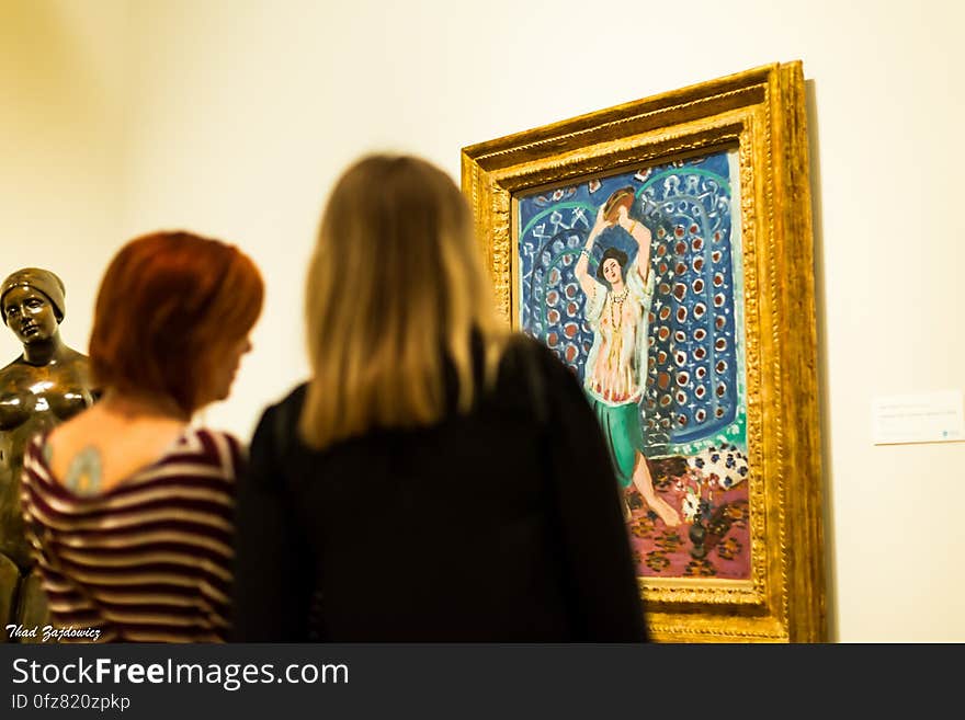 Two visitors to the Norton Simon Museum in Pasadena, California admiring Henri Matisse&#x27;s Odalisque with Tambourine &#x28;Harmony in Blue&#x29;, 1926. Two visitors to the Norton Simon Museum in Pasadena, California admiring Henri Matisse&#x27;s Odalisque with Tambourine &#x28;Harmony in Blue&#x29;, 1926.