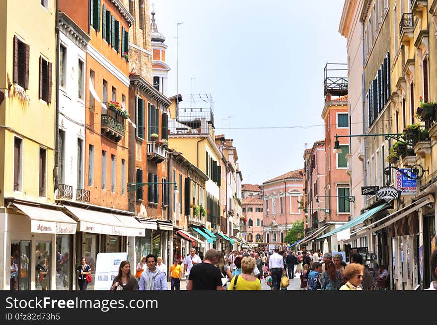 The water streets of Venice are canals which are navigated by gondolas and other small boats. During daylight hours the canals, bridges, and streets of Venice are full of tourists eager to experience the romance of this great travel destination. As night engulfs the town, tourists enjoy some fine dining at one of the many restaurants, leaving the waterways and streets quiet. The gondola is a traditional, flat-bottomed Venetian rowing boat, well suited to the conditions of the Venetian Lagoon. For centuries gondolas were once the chief means of transportation and most common watercraft within Venice. In modern times the iconic boats still have a role in public transport in the city, serving as ferries over the Grand Canal. They are also used in special regattas &#x28;rowing races&#x29; held amongst gondoliers. Their main role, however, is to carry tourists on rides throughout the canals. Gondolas are hand made using 8 different types of wood &#x28;fir, oak, cherry, walnut, elm, mahogany, larch and lime&#x29; and are composed of 280 pieces. The oars are made of beech wood. The left side of the gondola is longer than the right side. This asymmetry causes the gondola to resist the tendency to turn toward the left at the forward stroke. The water streets of Venice are canals which are navigated by gondolas and other small boats. During daylight hours the canals, bridges, and streets of Venice are full of tourists eager to experience the romance of this great travel destination. As night engulfs the town, tourists enjoy some fine dining at one of the many restaurants, leaving the waterways and streets quiet. The gondola is a traditional, flat-bottomed Venetian rowing boat, well suited to the conditions of the Venetian Lagoon. For centuries gondolas were once the chief means of transportation and most common watercraft within Venice. In modern times the iconic boats still have a role in public transport in the city, serving as ferries over the Grand Canal. They are also used in special regattas &#x28;rowing races&#x29; held amongst gondoliers. Their main role, however, is to carry tourists on rides throughout the canals. Gondolas are hand made using 8 different types of wood &#x28;fir, oak, cherry, walnut, elm, mahogany, larch and lime&#x29; and are composed of 280 pieces. The oars are made of beech wood. The left side of the gondola is longer than the right side. This asymmetry causes the gondola to resist the tendency to turn toward the left at the forward stroke.