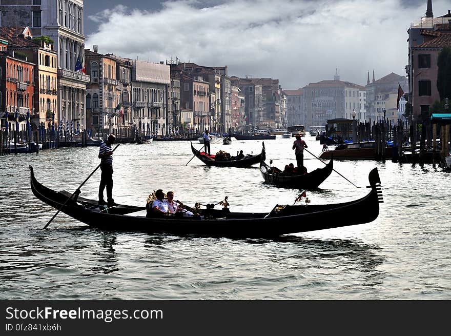 www.flickr.com/photos/joxxsx/7571915034/in/photostream www.tripify.com/blog/100-best-places-to-visit-in-italy The water streets of Venice are canals which are navigated by gondolas and other small boats. During daylight hours the canals, bridges, and streets of Venice are full of tourists eager to experience the romance of this great travel destination. As night engulfs the town, tourists enjoy some fine dining at one of the many restaurants, leaving the waterways and streets quiet. The gondola is a traditional, flat-bottomed Venetian rowing boat, well suited to the conditions of the Venetian Lagoon. For centuries gondolas were once the chief means of transportation and most common watercraft within Venice. In modern times the iconic boats still have a role in public transport in the city, serving as ferries over the Grand Canal. They are also used in special regattas &#x28;rowing races&#x29; held amongst gondoliers. Their main role, however, is to carry tourists on rides throughout the canals. Gondolas are hand made using 8 different types of wood &#x28;fir, oak, cherry, walnut, elm, mahogany, larch and lime&#x29; and are composed of 280 pieces. The oars are made of beech wood. The left side of the gondola is longer than the right side. This asymmetry causes the gondola to resist the tendency to turn toward the left at the forward stroke. www.flickr.com/photos/joxxsx/7571915034/in/photostream www.tripify.com/blog/100-best-places-to-visit-in-italy The water streets of Venice are canals which are navigated by gondolas and other small boats. During daylight hours the canals, bridges, and streets of Venice are full of tourists eager to experience the romance of this great travel destination. As night engulfs the town, tourists enjoy some fine dining at one of the many restaurants, leaving the waterways and streets quiet. The gondola is a traditional, flat-bottomed Venetian rowing boat, well suited to the conditions of the Venetian Lagoon. For centuries gondolas were once the chief means of transportation and most common watercraft within Venice. In modern times the iconic boats still have a role in public transport in the city, serving as ferries over the Grand Canal. They are also used in special regattas &#x28;rowing races&#x29; held amongst gondoliers. Their main role, however, is to carry tourists on rides throughout the canals. Gondolas are hand made using 8 different types of wood &#x28;fir, oak, cherry, walnut, elm, mahogany, larch and lime&#x29; and are composed of 280 pieces. The oars are made of beech wood. The left side of the gondola is longer than the right side. This asymmetry causes the gondola to resist the tendency to turn toward the left at the forward stroke.