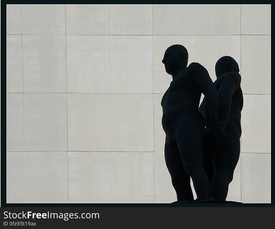 On the plaza is a mythic landscape: a cone of local rundle stone is a reference to the mountains; overscaled bronze ammonites a hidden landscape exposed. Standing on top, between earth and sky, are two bronze figures, back to back. Standing to the side, holding a fossil, is another figure – his gaze distracted by the view of the sky. On the plaza is a mythic landscape: a cone of local rundle stone is a reference to the mountains; overscaled bronze ammonites a hidden landscape exposed. Standing on top, between earth and sky, are two bronze figures, back to back. Standing to the side, holding a fossil, is another figure – his gaze distracted by the view of the sky.