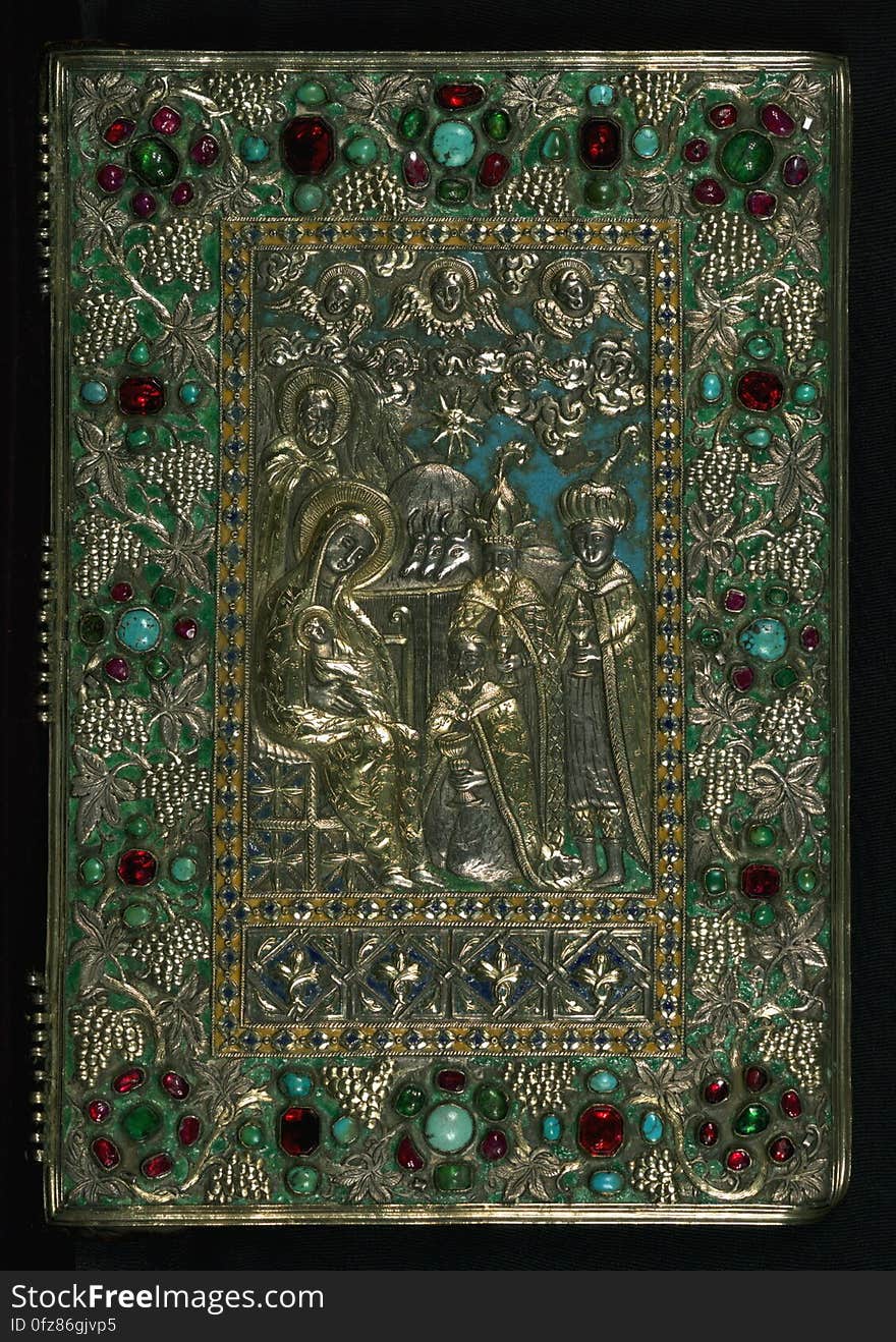 Upper and lower boards made of wood and covered with goatskin, with a rectangular goatskin flap attached to the lower board to protect the fore-edge; two silver plaques have been attached to the upper and lower boards and are joined across the spine through use of 3 sets of 5 silver chains; upper-board silver plaque depicts the Adoration of the Magi in a central, rectangular field, with the figures and decorative elements in repoussé and gilded, with carefully incised details and blue, green, and yellow enamel employed for spatial and decorative effects; outer border is filled with grape-cluster motifs within a green-enamel background and semi-precious gems in the shape of rosettes and crosses; lower-board silver plaque incorporates the same decorative elements and design as the upper-board, but the central scene depicts the Ascension of Christ, with the heavenly background filled in with a marbled white enamel and the earthly background below in blue; inner boards lined with blue linen. This manuscript was executed in 1475 by a scribe identified as Aristakes, for a priest named Hakob. It contains a series of 16 images on the life of Christ preceding the text of the gospels, as well as the traditional evangelist portraits, and there are marginal illustrations throughout. The style of the miniatures, which employ brilliant colors and emphasize decorative patterns, is characteristic of manuscript production in the region around Lake Van during the 15th century. The style of Lake Van has often been described in relation to schools of Islamic arts of the book. Numerous inscriptions &#x28;on fols. 258-60&#x29; spanning a few centuries attest to the manuscript&#x27;s long history of use and revered preservation. The codex&#x27;s later history included a re-binding with silver covers from Kayseri that date to approximately 1700. This jeweled and enameled silver binding bears a composition of the Adoration of the Magi on the front and the Ascension on the back. Upper and lower boards made of wood and covered with goatskin, with a rectangular goatskin flap attached to the lower board to protect the fore-edge; two silver plaques have been attached to the upper and lower boards and are joined across the spine through use of 3 sets of 5 silver chains; upper-board silver plaque depicts the Adoration of the Magi in a central, rectangular field, with the figures and decorative elements in repoussé and gilded, with carefully incised details and blue, green, and yellow enamel employed for spatial and decorative effects; outer border is filled with grape-cluster motifs within a green-enamel background and semi-precious gems in the shape of rosettes and crosses; lower-board silver plaque incorporates the same decorative elements and design as the upper-board, but the central scene depicts the Ascension of Christ, with the heavenly background filled in with a marbled white enamel and the earthly background below in blue; inner boards lined with blue linen. This manuscript was executed in 1475 by a scribe identified as Aristakes, for a priest named Hakob. It contains a series of 16 images on the life of Christ preceding the text of the gospels, as well as the traditional evangelist portraits, and there are marginal illustrations throughout. The style of the miniatures, which employ brilliant colors and emphasize decorative patterns, is characteristic of manuscript production in the region around Lake Van during the 15th century. The style of Lake Van has often been described in relation to schools of Islamic arts of the book. Numerous inscriptions &#x28;on fols. 258-60&#x29; spanning a few centuries attest to the manuscript&#x27;s long history of use and revered preservation. The codex&#x27;s later history included a re-binding with silver covers from Kayseri that date to approximately 1700. This jeweled and enameled silver binding bears a composition of the Adoration of the Magi on the front and the Ascension on the back.