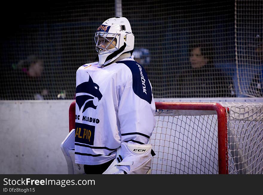 Man in White and Blue Jersey Shirt on Field