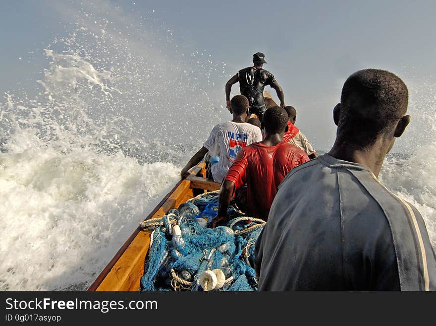 Five Men Riding on Boat