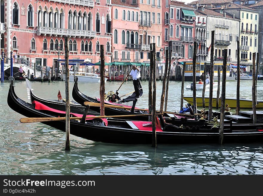 The water streets of Venice are canals which are navigated by gondolas and other small boats. During daylight hours the canals, bridges, and streets of Venice are full of tourists eager to experience the romance of this great travel destination. As night engulfs the town, tourists enjoy some fine dining at one of the many restaurants, leaving the waterways and streets quiet. The gondola is a traditional, flat-bottomed Venetian rowing boat, well suited to the conditions of the Venetian Lagoon. For centuries gondolas were once the chief means of transportation and most common watercraft within Venice. In modern times the iconic boats still have a role in public transport in the city, serving as ferries over the Grand Canal. They are also used in special regattas &#x28;rowing races&#x29; held amongst gondoliers. Their main role, however, is to carry tourists on rides throughout the canals. Gondolas are hand made using 8 different types of wood &#x28;fir, oak, cherry, walnut, elm, mahogany, larch and lime&#x29; and are composed of 280 pieces. The oars are made of beech wood. The left side of the gondola is longer than the right side. This asymmetry causes the gondola to resist the tendency to turn toward the left at the forward stroke. The water streets of Venice are canals which are navigated by gondolas and other small boats. During daylight hours the canals, bridges, and streets of Venice are full of tourists eager to experience the romance of this great travel destination. As night engulfs the town, tourists enjoy some fine dining at one of the many restaurants, leaving the waterways and streets quiet. The gondola is a traditional, flat-bottomed Venetian rowing boat, well suited to the conditions of the Venetian Lagoon. For centuries gondolas were once the chief means of transportation and most common watercraft within Venice. In modern times the iconic boats still have a role in public transport in the city, serving as ferries over the Grand Canal. They are also used in special regattas &#x28;rowing races&#x29; held amongst gondoliers. Their main role, however, is to carry tourists on rides throughout the canals. Gondolas are hand made using 8 different types of wood &#x28;fir, oak, cherry, walnut, elm, mahogany, larch and lime&#x29; and are composed of 280 pieces. The oars are made of beech wood. The left side of the gondola is longer than the right side. This asymmetry causes the gondola to resist the tendency to turn toward the left at the forward stroke.