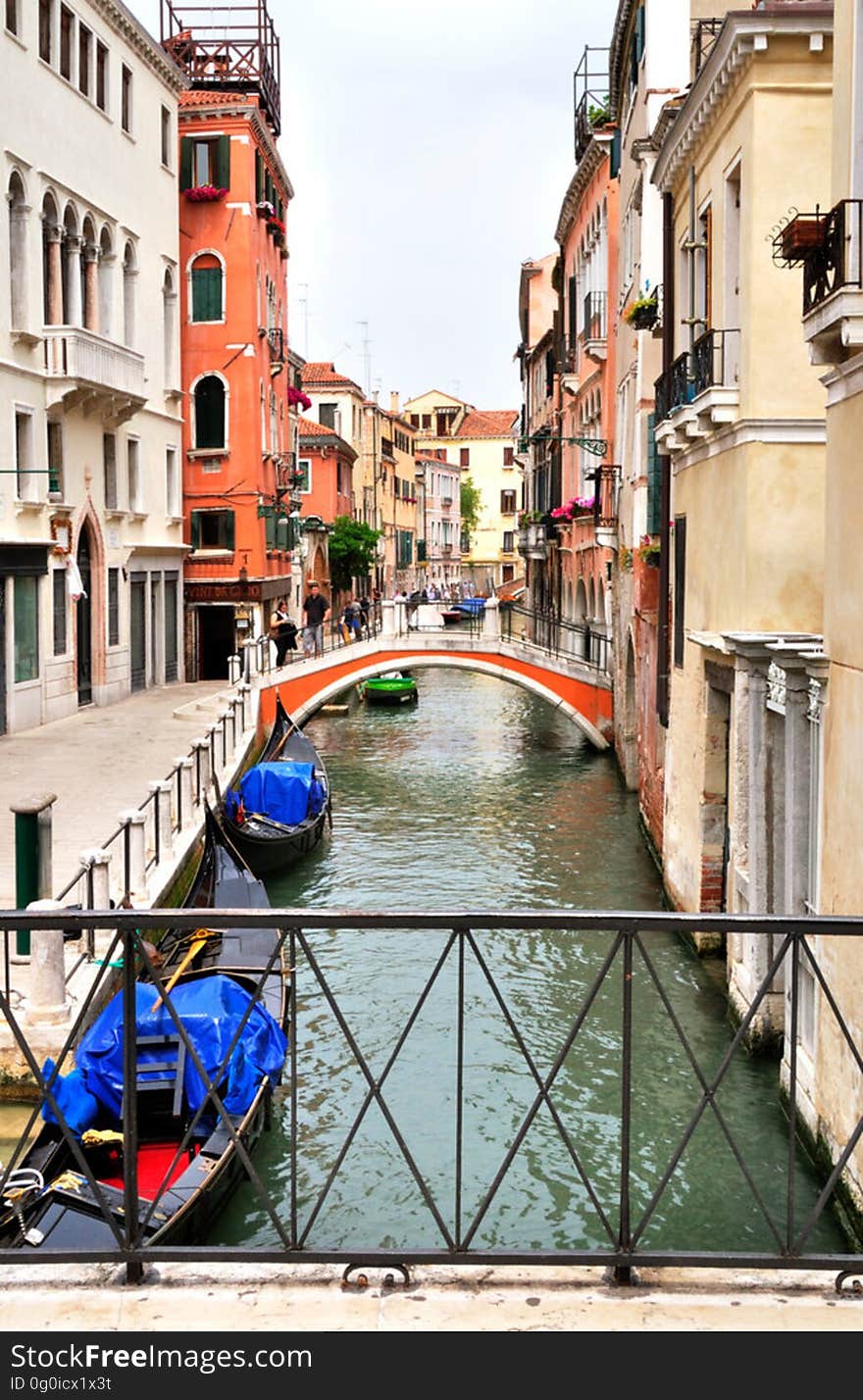 The water streets of Venice are canals which are navigated by gondolas and other small boats. During daylight hours the canals, bridges, and streets of Venice are full of tourists eager to experience the romance of this great travel destination. As night engulfs the town, tourists enjoy some fine dining at one of the many restaurants, leaving the waterways and streets quiet. The gondola is a traditional, flat-bottomed Venetian rowing boat, well suited to the conditions of the Venetian Lagoon. For centuries gondolas were once the chief means of transportation and most common watercraft within Venice. In modern times the iconic boats still have a role in public transport in the city, serving as ferries over the Grand Canal. They are also used in special regattas &#x28;rowing races&#x29; held amongst gondoliers. Their main role, however, is to carry tourists on rides throughout the canals. Gondolas are hand made using 8 different types of wood &#x28;fir, oak, cherry, walnut, elm, mahogany, larch and lime&#x29; and are composed of 280 pieces. The oars are made of beech wood. The left side of the gondola is longer than the right side. This asymmetry causes the gondola to resist the tendency to turn toward the left at the forward stroke. The water streets of Venice are canals which are navigated by gondolas and other small boats. During daylight hours the canals, bridges, and streets of Venice are full of tourists eager to experience the romance of this great travel destination. As night engulfs the town, tourists enjoy some fine dining at one of the many restaurants, leaving the waterways and streets quiet. The gondola is a traditional, flat-bottomed Venetian rowing boat, well suited to the conditions of the Venetian Lagoon. For centuries gondolas were once the chief means of transportation and most common watercraft within Venice. In modern times the iconic boats still have a role in public transport in the city, serving as ferries over the Grand Canal. They are also used in special regattas &#x28;rowing races&#x29; held amongst gondoliers. Their main role, however, is to carry tourists on rides throughout the canals. Gondolas are hand made using 8 different types of wood &#x28;fir, oak, cherry, walnut, elm, mahogany, larch and lime&#x29; and are composed of 280 pieces. The oars are made of beech wood. The left side of the gondola is longer than the right side. This asymmetry causes the gondola to resist the tendency to turn toward the left at the forward stroke.