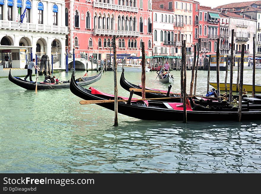 The water streets of Venice are canals which are navigated by gondolas and other small boats. During daylight hours the canals, bridges, and streets of Venice are full of tourists eager to experience the romance of this great travel destination. As night engulfs the town, tourists enjoy some fine dining at one of the many restaurants, leaving the waterways and streets quiet. The gondola is a traditional, flat-bottomed Venetian rowing boat, well suited to the conditions of the Venetian Lagoon. For centuries gondolas were once the chief means of transportation and most common watercraft within Venice. In modern times the iconic boats still have a role in public transport in the city, serving as ferries over the Grand Canal. They are also used in special regattas &#x28;rowing races&#x29; held amongst gondoliers. Their main role, however, is to carry tourists on rides throughout the canals. Gondolas are hand made using 8 different types of wood &#x28;fir, oak, cherry, walnut, elm, mahogany, larch and lime&#x29; and are composed of 280 pieces. The oars are made of beech wood. The left side of the gondola is longer than the right side. This asymmetry causes the gondola to resist the tendency to turn toward the left at the forward stroke. The water streets of Venice are canals which are navigated by gondolas and other small boats. During daylight hours the canals, bridges, and streets of Venice are full of tourists eager to experience the romance of this great travel destination. As night engulfs the town, tourists enjoy some fine dining at one of the many restaurants, leaving the waterways and streets quiet. The gondola is a traditional, flat-bottomed Venetian rowing boat, well suited to the conditions of the Venetian Lagoon. For centuries gondolas were once the chief means of transportation and most common watercraft within Venice. In modern times the iconic boats still have a role in public transport in the city, serving as ferries over the Grand Canal. They are also used in special regattas &#x28;rowing races&#x29; held amongst gondoliers. Their main role, however, is to carry tourists on rides throughout the canals. Gondolas are hand made using 8 different types of wood &#x28;fir, oak, cherry, walnut, elm, mahogany, larch and lime&#x29; and are composed of 280 pieces. The oars are made of beech wood. The left side of the gondola is longer than the right side. This asymmetry causes the gondola to resist the tendency to turn toward the left at the forward stroke.