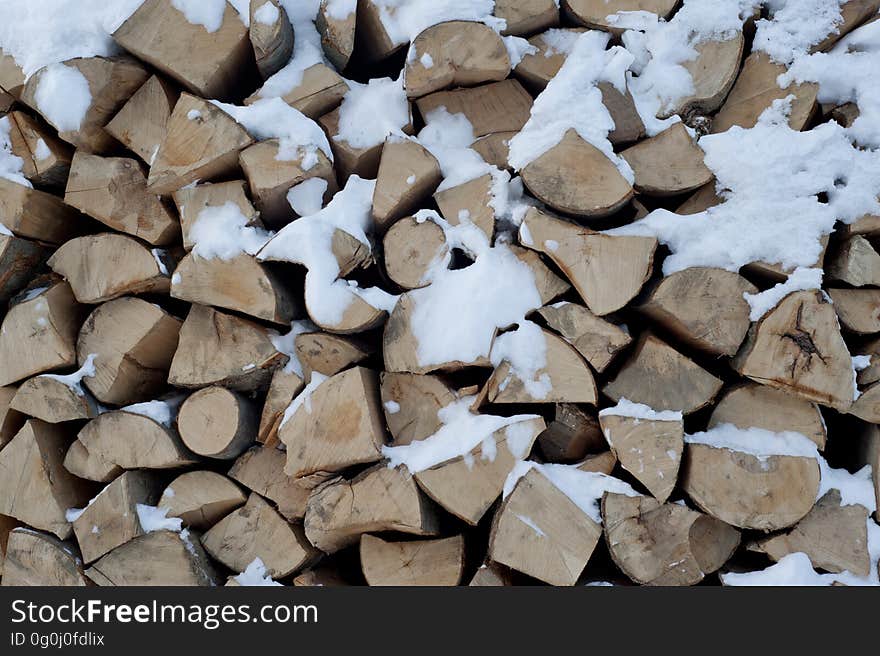 A pile of firewood chopped up in the winter. A pile of firewood chopped up in the winter.