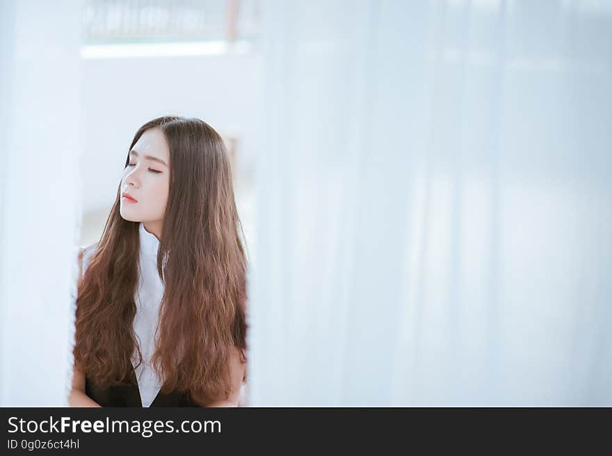 Brown Haired Woman in White and Black Shirt