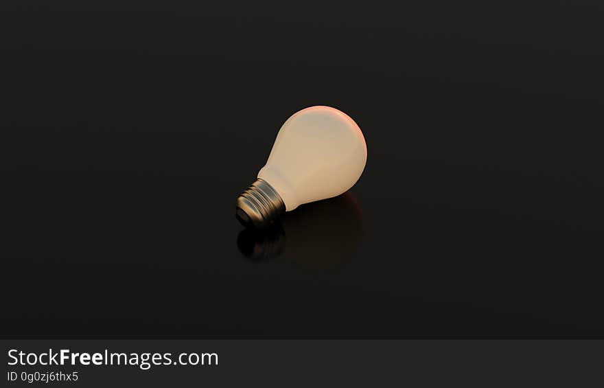 A lone lightbulb on dark background.