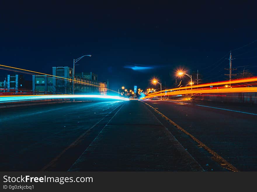 Light trails left by traffic with long exposure on a highway at night. Light trails left by traffic with long exposure on a highway at night.