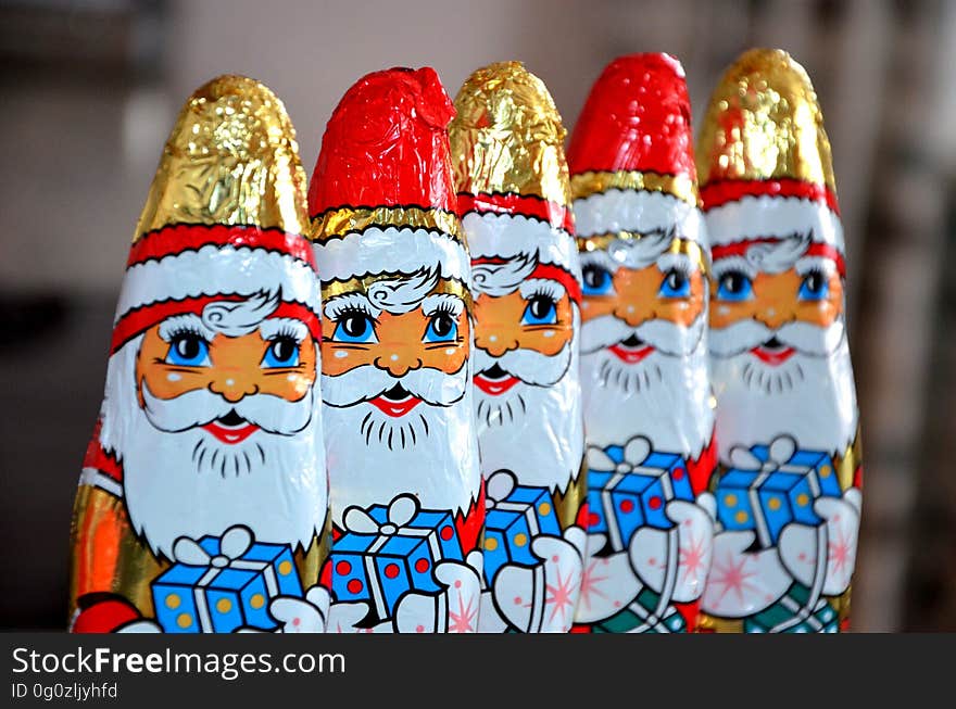 Red White Gold and Blue Santa Claus Carrying Gift Sweets Line