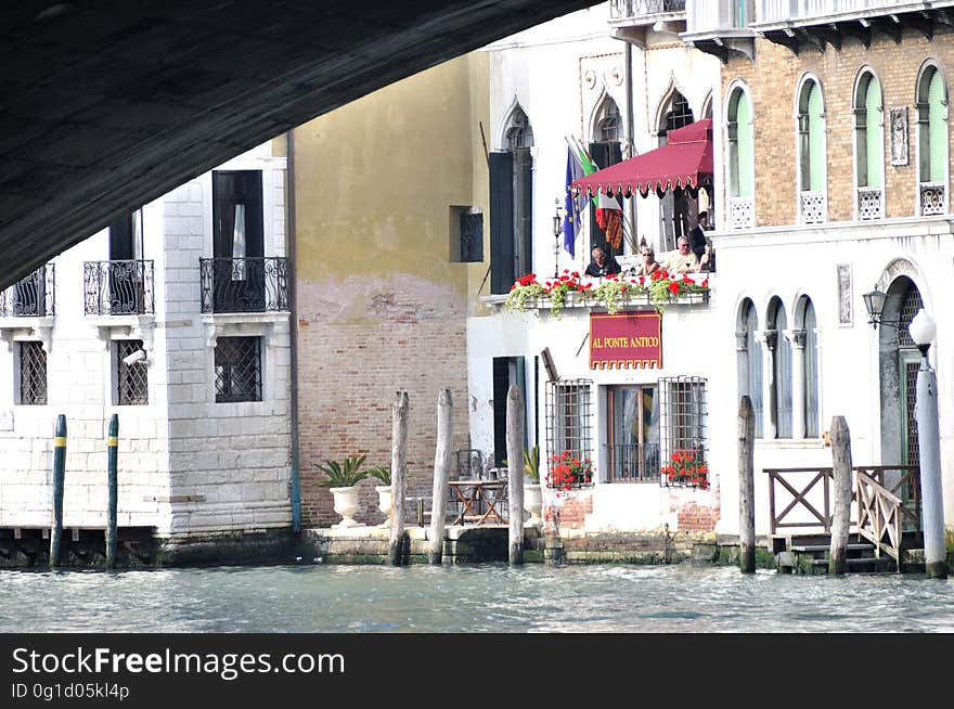 The water streets of Venice are canals which are navigated by gondolas and other small boats. During daylight hours the canals, bridges, and streets of Venice are full of tourists eager to experience the romance of this great travel destination. As night engulfs the town, tourists enjoy some fine dining at one of the many restaurants, leaving the waterways and streets quiet. The gondola is a traditional, flat-bottomed Venetian rowing boat, well suited to the conditions of the Venetian Lagoon. For centuries gondolas were once the chief means of transportation and most common watercraft within Venice. In modern times the iconic boats still have a role in public transport in the city, serving as ferries over the Grand Canal. They are also used in special regattas &#x28;rowing races&#x29; held amongst gondoliers. Their main role, however, is to carry tourists on rides throughout the canals. Gondolas are hand made using 8 different types of wood &#x28;fir, oak, cherry, walnut, elm, mahogany, larch and lime&#x29; and are composed of 280 pieces. The oars are made of beech wood. The left side of the gondola is longer than the right side. This asymmetry causes the gondola to resist the tendency to turn toward the left at the forward stroke. The water streets of Venice are canals which are navigated by gondolas and other small boats. During daylight hours the canals, bridges, and streets of Venice are full of tourists eager to experience the romance of this great travel destination. As night engulfs the town, tourists enjoy some fine dining at one of the many restaurants, leaving the waterways and streets quiet. The gondola is a traditional, flat-bottomed Venetian rowing boat, well suited to the conditions of the Venetian Lagoon. For centuries gondolas were once the chief means of transportation and most common watercraft within Venice. In modern times the iconic boats still have a role in public transport in the city, serving as ferries over the Grand Canal. They are also used in special regattas &#x28;rowing races&#x29; held amongst gondoliers. Their main role, however, is to carry tourists on rides throughout the canals. Gondolas are hand made using 8 different types of wood &#x28;fir, oak, cherry, walnut, elm, mahogany, larch and lime&#x29; and are composed of 280 pieces. The oars are made of beech wood. The left side of the gondola is longer than the right side. This asymmetry causes the gondola to resist the tendency to turn toward the left at the forward stroke.