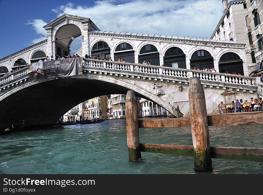 The water streets of Venice are canals which are navigated by gondolas and other small boats. During daylight hours the canals, bridges, and streets of Venice are full of tourists eager to experience the romance of this great travel destination. As night engulfs the town, tourists enjoy some fine dining at one of the many restaurants, leaving the waterways and streets quiet. The gondola is a traditional, flat-bottomed Venetian rowing boat, well suited to the conditions of the Venetian Lagoon. For centuries gondolas were once the chief means of transportation and most common watercraft within Venice. In modern times the iconic boats still have a role in public transport in the city, serving as ferries over the Grand Canal. They are also used in special regattas &#x28;rowing races&#x29; held amongst gondoliers. Their main role, however, is to carry tourists on rides throughout the canals. Gondolas are hand made using 8 different types of wood &#x28;fir, oak, cherry, walnut, elm, mahogany, larch and lime&#x29; and are composed of 280 pieces. The oars are made of beech wood. The left side of the gondola is longer than the right side. This asymmetry causes the gondola to resist the tendency to turn toward the left at the forward stroke. The water streets of Venice are canals which are navigated by gondolas and other small boats. During daylight hours the canals, bridges, and streets of Venice are full of tourists eager to experience the romance of this great travel destination. As night engulfs the town, tourists enjoy some fine dining at one of the many restaurants, leaving the waterways and streets quiet. The gondola is a traditional, flat-bottomed Venetian rowing boat, well suited to the conditions of the Venetian Lagoon. For centuries gondolas were once the chief means of transportation and most common watercraft within Venice. In modern times the iconic boats still have a role in public transport in the city, serving as ferries over the Grand Canal. They are also used in special regattas &#x28;rowing races&#x29; held amongst gondoliers. Their main role, however, is to carry tourists on rides throughout the canals. Gondolas are hand made using 8 different types of wood &#x28;fir, oak, cherry, walnut, elm, mahogany, larch and lime&#x29; and are composed of 280 pieces. The oars are made of beech wood. The left side of the gondola is longer than the right side. This asymmetry causes the gondola to resist the tendency to turn toward the left at the forward stroke.