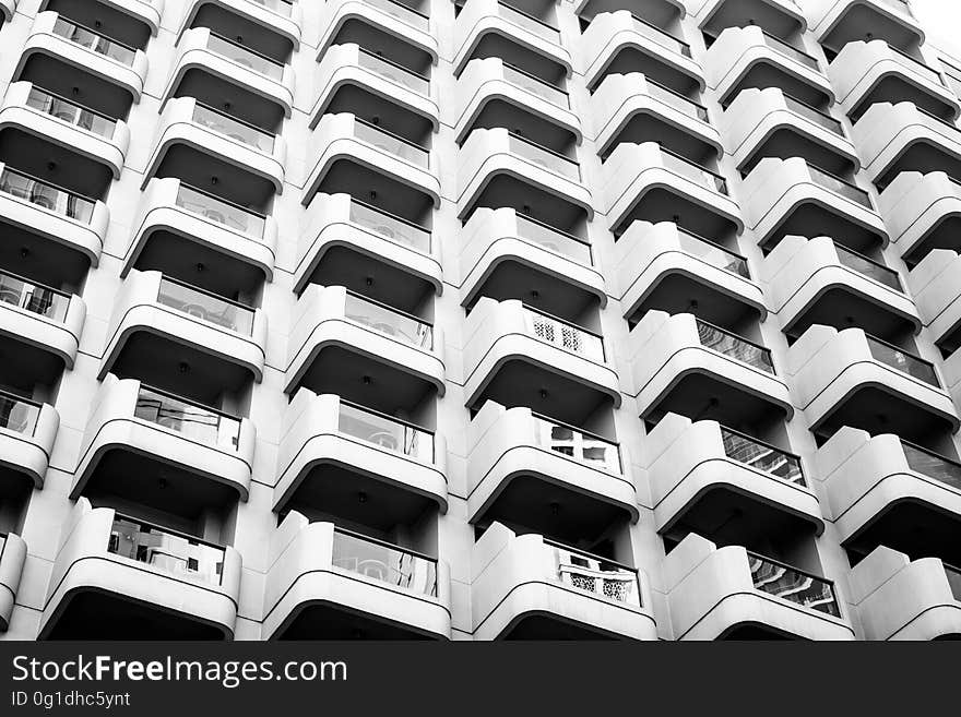 A view outside of an apartment block with balconies.