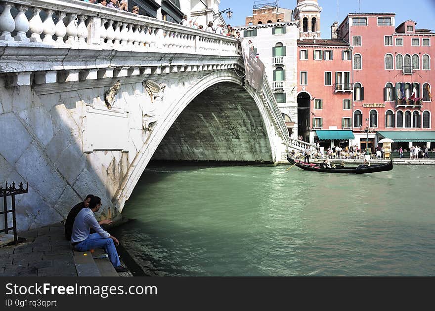 The water streets of Venice are canals which are navigated by gondolas and other small boats. During daylight hours the canals, bridges, and streets of Venice are full of tourists eager to experience the romance of this great travel destination. As night engulfs the town, tourists enjoy some fine dining at one of the many restaurants, leaving the waterways and streets quiet. The gondola is a traditional, flat-bottomed Venetian rowing boat, well suited to the conditions of the Venetian Lagoon. For centuries gondolas were once the chief means of transportation and most common watercraft within Venice. In modern times the iconic boats still have a role in public transport in the city, serving as ferries over the Grand Canal. They are also used in special regattas &#x28;rowing races&#x29; held amongst gondoliers. Their main role, however, is to carry tourists on rides throughout the canals. Gondolas are hand made using 8 different types of wood &#x28;fir, oak, cherry, walnut, elm, mahogany, larch and lime&#x29; and are composed of 280 pieces. The oars are made of beech wood. The left side of the gondola is longer than the right side. This asymmetry causes the gondola to resist the tendency to turn toward the left at the forward stroke. The water streets of Venice are canals which are navigated by gondolas and other small boats. During daylight hours the canals, bridges, and streets of Venice are full of tourists eager to experience the romance of this great travel destination. As night engulfs the town, tourists enjoy some fine dining at one of the many restaurants, leaving the waterways and streets quiet. The gondola is a traditional, flat-bottomed Venetian rowing boat, well suited to the conditions of the Venetian Lagoon. For centuries gondolas were once the chief means of transportation and most common watercraft within Venice. In modern times the iconic boats still have a role in public transport in the city, serving as ferries over the Grand Canal. They are also used in special regattas &#x28;rowing races&#x29; held amongst gondoliers. Their main role, however, is to carry tourists on rides throughout the canals. Gondolas are hand made using 8 different types of wood &#x28;fir, oak, cherry, walnut, elm, mahogany, larch and lime&#x29; and are composed of 280 pieces. The oars are made of beech wood. The left side of the gondola is longer than the right side. This asymmetry causes the gondola to resist the tendency to turn toward the left at the forward stroke.