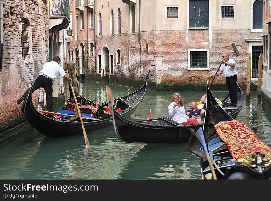 The water streets of Venice are canals which are navigated by gondolas and other small boats. During daylight hours the canals, bridges, and streets of Venice are full of tourists eager to experience the romance of this great travel destination. As night engulfs the town, tourists enjoy some fine dining at one of the many restaurants, leaving the waterways and streets quiet. The gondola is a traditional, flat-bottomed Venetian rowing boat, well suited to the conditions of the Venetian Lagoon. For centuries gondolas were once the chief means of transportation and most common watercraft within Venice. In modern times the iconic boats still have a role in public transport in the city, serving as ferries over the Grand Canal. They are also used in special regattas &#x28;rowing races&#x29; held amongst gondoliers. Their main role, however, is to carry tourists on rides throughout the canals. Gondolas are hand made using 8 different types of wood &#x28;fir, oak, cherry, walnut, elm, mahogany, larch and lime&#x29; and are composed of 280 pieces. The oars are made of beech wood. The left side of the gondola is longer than the right side. This asymmetry causes the gondola to resist the tendency to turn toward the left at the forward stroke. Venetian masks are a centuries-old tradition of Venice. The masks are typically worn during the Carnival of Venice, but have been used on many other occasions in the past, usually as a device for hiding the wearer&#x27;s identity and social status. The mask would permit the wearer to act more freely in cases where he or she wanted to interact with other members of the society outside the bounds of identity and everyday convention. It was thus useful for a variety of purposes, some of them illicit or criminal, others just personal, such as romantic encounters. The water streets of Venice are canals which are navigated by gondolas and other small boats. During daylight hours the canals, bridges, and streets of Venice are full of tourists eager to experience the romance of this great travel destination. As night engulfs the town, tourists enjoy some fine dining at one of the many restaurants, leaving the waterways and streets quiet. The gondola is a traditional, flat-bottomed Venetian rowing boat, well suited to the conditions of the Venetian Lagoon. For centuries gondolas were once the chief means of transportation and most common watercraft within Venice. In modern times the iconic boats still have a role in public transport in the city, serving as ferries over the Grand Canal. They are also used in special regattas &#x28;rowing races&#x29; held amongst gondoliers. Their main role, however, is to carry tourists on rides throughout the canals. Gondolas are hand made using 8 different types of wood &#x28;fir, oak, cherry, walnut, elm, mahogany, larch and lime&#x29; and are composed of 280 pieces. The oars are made of beech wood. The left side of the gondola is longer than the right side. This asymmetry causes the gondola to resist the tendency to turn toward the left at the forward stroke. Venetian masks are a centuries-old tradition of Venice. The masks are typically worn during the Carnival of Venice, but have been used on many other occasions in the past, usually as a device for hiding the wearer&#x27;s identity and social status. The mask would permit the wearer to act more freely in cases where he or she wanted to interact with other members of the society outside the bounds of identity and everyday convention. It was thus useful for a variety of purposes, some of them illicit or criminal, others just personal, such as romantic encounters.