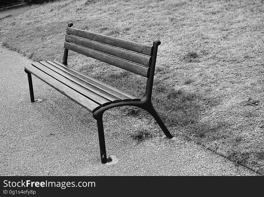 A park bench in black and white.