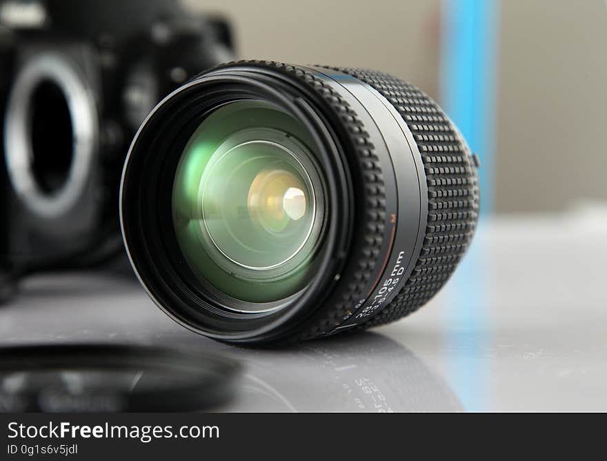 Black Camera Lens on White Sureface