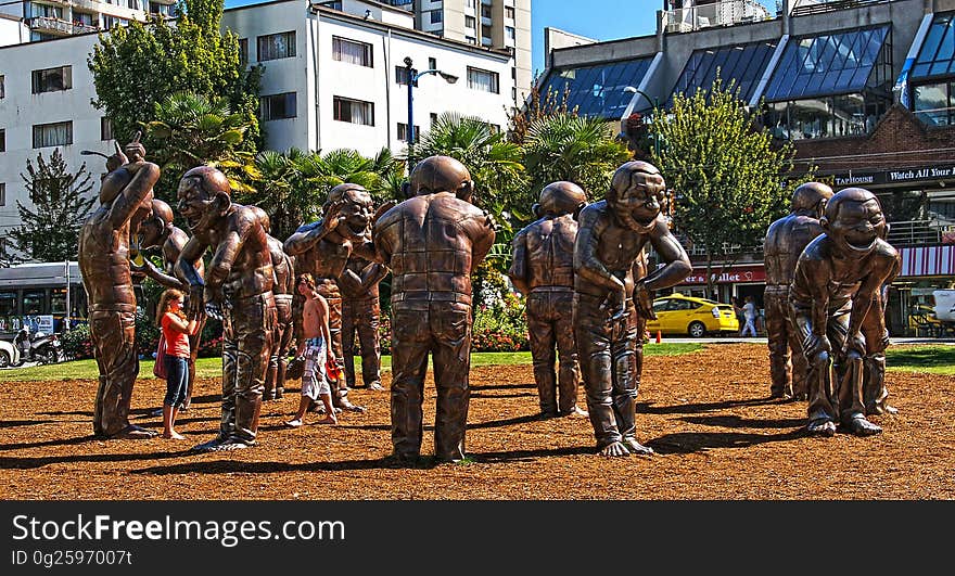 A-maze-ing Laughter was designed by Yue Minjun and installed in Morton Park along the English Bay in West End, Vancouver in 2009. The patinated bronze sculpture portrays the artist&#x27;s own image &#x22;in a state of hysterical laughter&#x22;. It was created as part of the Vancouver International Sculpture Biennale, which exhibits international contemporary works in public spaces. The sculpture was donated to the City of Vancouver by Chip and Shannon Wilson through the Wilson Foundation on August 11, 2012. A-maze-ing Laughter was designed by Yue Minjun and installed in Morton Park along the English Bay in West End, Vancouver in 2009. The patinated bronze sculpture portrays the artist&#x27;s own image &#x22;in a state of hysterical laughter&#x22;. It was created as part of the Vancouver International Sculpture Biennale, which exhibits international contemporary works in public spaces. The sculpture was donated to the City of Vancouver by Chip and Shannon Wilson through the Wilson Foundation on August 11, 2012