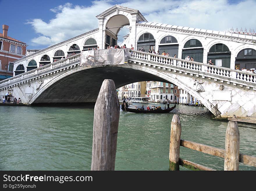 The water streets of Venice are canals which are navigated by gondolas and other small boats. During daylight hours the canals, bridges, and streets of Venice are full of tourists eager to experience the romance of this great travel destination. As night engulfs the town, tourists enjoy some fine dining at one of the many restaurants, leaving the waterways and streets quiet. The gondola is a traditional, flat-bottomed Venetian rowing boat, well suited to the conditions of the Venetian Lagoon. For centuries gondolas were once the chief means of transportation and most common watercraft within Venice. In modern times the iconic boats still have a role in public transport in the city, serving as ferries over the Grand Canal. They are also used in special regattas &#x28;rowing races&#x29; held amongst gondoliers. Their main role, however, is to carry tourists on rides throughout the canals. Gondolas are hand made using 8 different types of wood &#x28;fir, oak, cherry, walnut, elm, mahogany, larch and lime&#x29; and are composed of 280 pieces. The oars are made of beech wood. The left side of the gondola is longer than the right side. This asymmetry causes the gondola to resist the tendency to turn toward the left at the forward stroke. The water streets of Venice are canals which are navigated by gondolas and other small boats. During daylight hours the canals, bridges, and streets of Venice are full of tourists eager to experience the romance of this great travel destination. As night engulfs the town, tourists enjoy some fine dining at one of the many restaurants, leaving the waterways and streets quiet. The gondola is a traditional, flat-bottomed Venetian rowing boat, well suited to the conditions of the Venetian Lagoon. For centuries gondolas were once the chief means of transportation and most common watercraft within Venice. In modern times the iconic boats still have a role in public transport in the city, serving as ferries over the Grand Canal. They are also used in special regattas &#x28;rowing races&#x29; held amongst gondoliers. Their main role, however, is to carry tourists on rides throughout the canals. Gondolas are hand made using 8 different types of wood &#x28;fir, oak, cherry, walnut, elm, mahogany, larch and lime&#x29; and are composed of 280 pieces. The oars are made of beech wood. The left side of the gondola is longer than the right side. This asymmetry causes the gondola to resist the tendency to turn toward the left at the forward stroke.