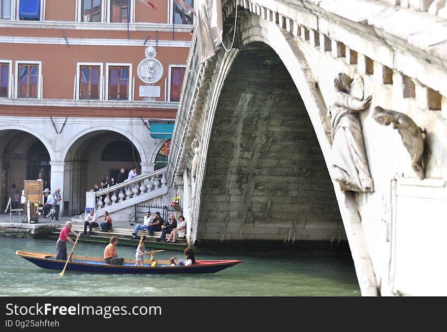 The water streets of Venice are canals which are navigated by gondolas and other small boats. During daylight hours the canals, bridges, and streets of Venice are full of tourists eager to experience the romance of this great travel destination. As night engulfs the town, tourists enjoy some fine dining at one of the many restaurants, leaving the waterways and streets quiet. The gondola is a traditional, flat-bottomed Venetian rowing boat, well suited to the conditions of the Venetian Lagoon. For centuries gondolas were once the chief means of transportation and most common watercraft within Venice. In modern times the iconic boats still have a role in public transport in the city, serving as ferries over the Grand Canal. They are also used in special regattas &#x28;rowing races&#x29; held amongst gondoliers. Their main role, however, is to carry tourists on rides throughout the canals. Gondolas are hand made using 8 different types of wood &#x28;fir, oak, cherry, walnut, elm, mahogany, larch and lime&#x29; and are composed of 280 pieces. The oars are made of beech wood. The left side of the gondola is longer than the right side. This asymmetry causes the gondola to resist the tendency to turn toward the left at the forward stroke. The water streets of Venice are canals which are navigated by gondolas and other small boats. During daylight hours the canals, bridges, and streets of Venice are full of tourists eager to experience the romance of this great travel destination. As night engulfs the town, tourists enjoy some fine dining at one of the many restaurants, leaving the waterways and streets quiet. The gondola is a traditional, flat-bottomed Venetian rowing boat, well suited to the conditions of the Venetian Lagoon. For centuries gondolas were once the chief means of transportation and most common watercraft within Venice. In modern times the iconic boats still have a role in public transport in the city, serving as ferries over the Grand Canal. They are also used in special regattas &#x28;rowing races&#x29; held amongst gondoliers. Their main role, however, is to carry tourists on rides throughout the canals. Gondolas are hand made using 8 different types of wood &#x28;fir, oak, cherry, walnut, elm, mahogany, larch and lime&#x29; and are composed of 280 pieces. The oars are made of beech wood. The left side of the gondola is longer than the right side. This asymmetry causes the gondola to resist the tendency to turn toward the left at the forward stroke.