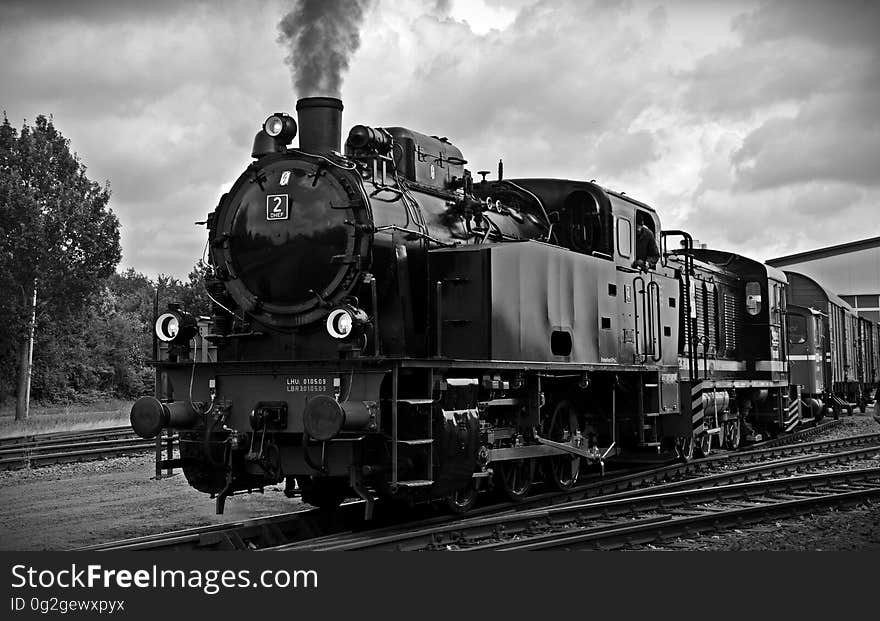 Train on Railroad Tracks Against Sky