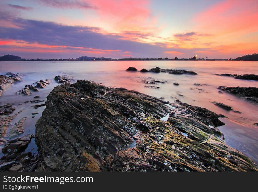 A rocky beach at dawn.