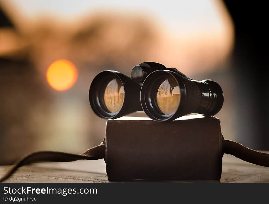 Black Binocular on Round Device