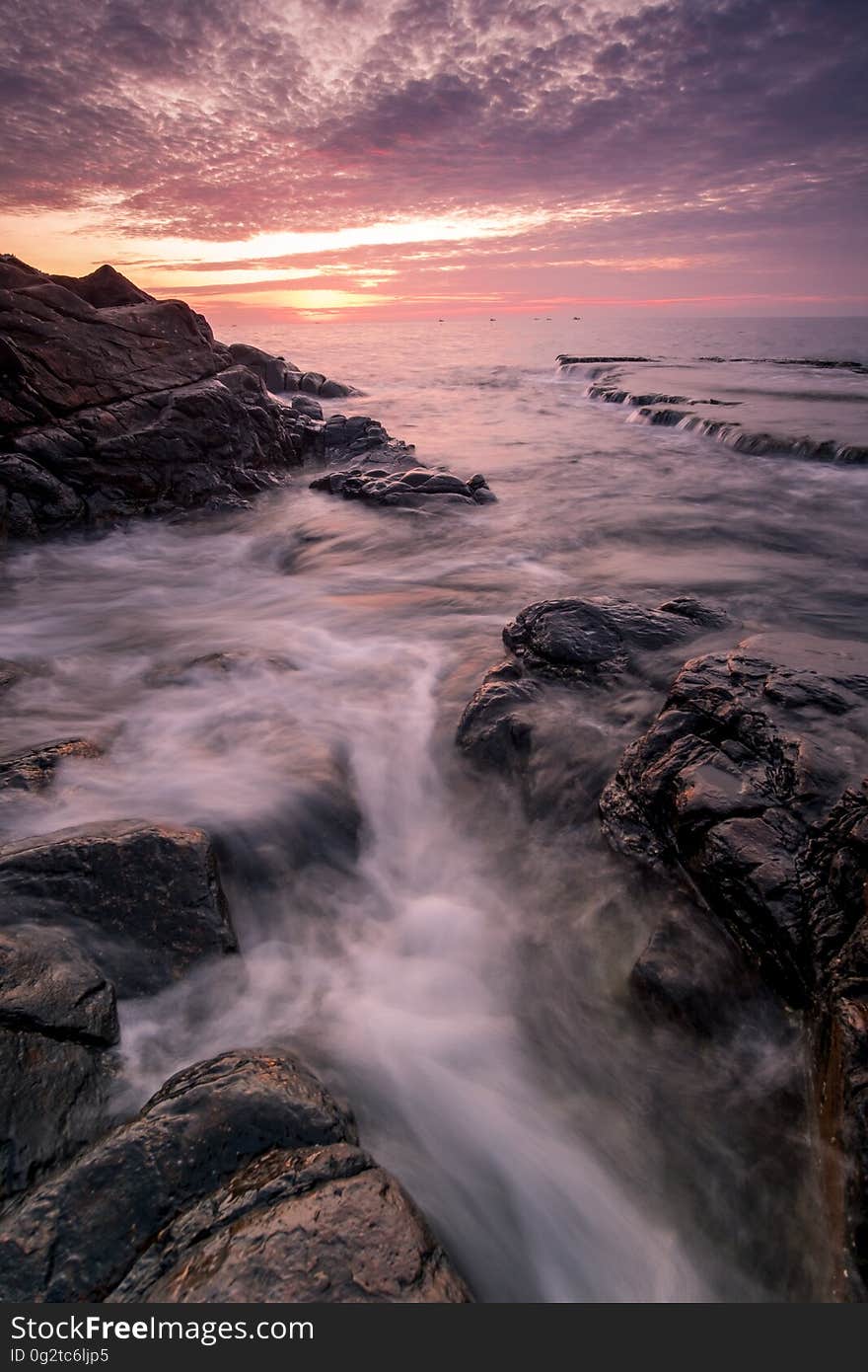 Running Water With Rock Formation during Golden Hour