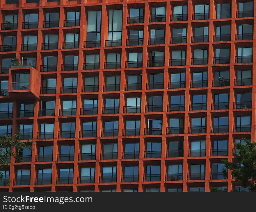 Geometric pattern of balconies on exterior of apartment building on sunny day. Geometric pattern of balconies on exterior of apartment building on sunny day.