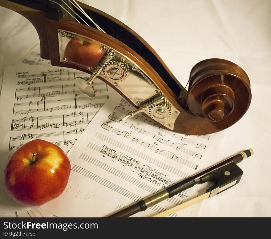 Red Apple Fruit on Music Sheet